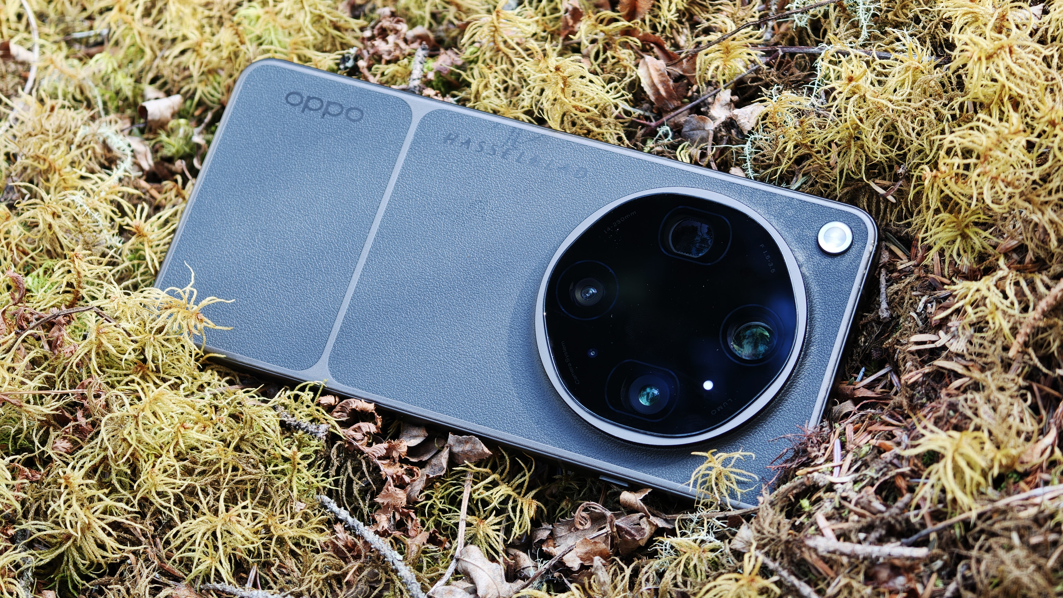 Oppo Find X9 Ultra phone on a mossy bed