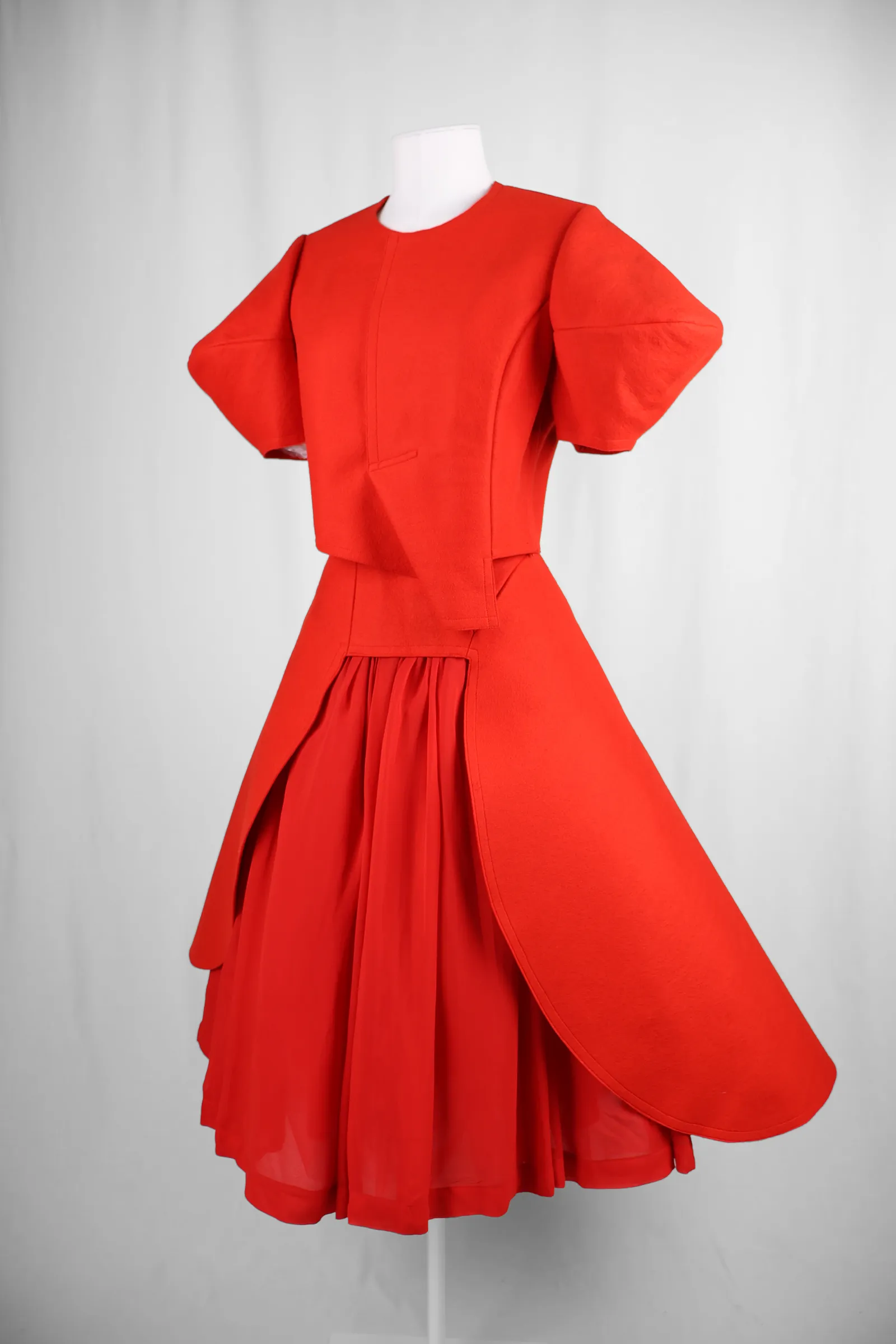 Image may contain Clothing Dress Formal Wear Coat Fashion Gown and Blouse