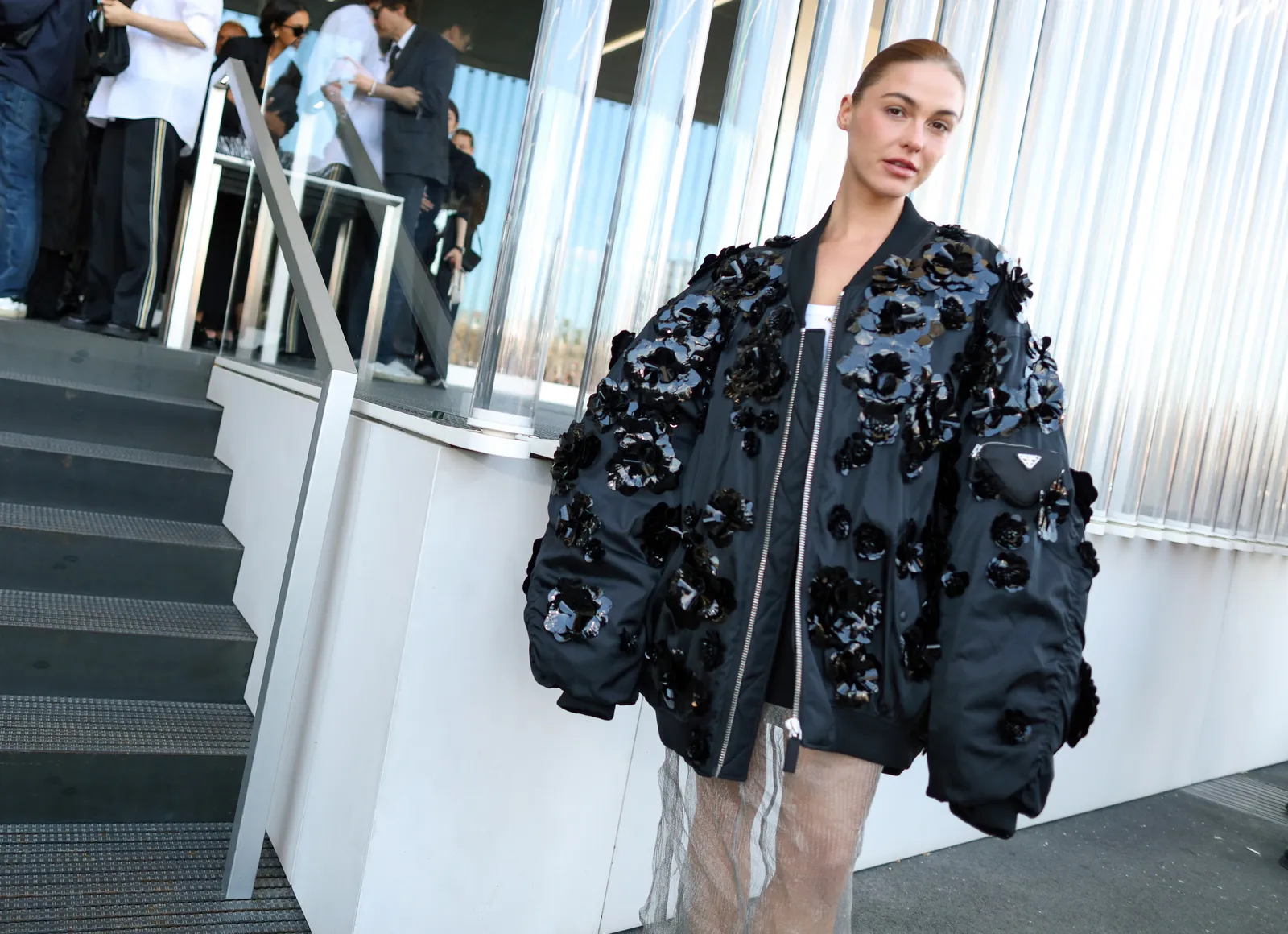 Image may contain Clothing Apparel Human Person Coat Sleeve Overcoat Banister and Handrail