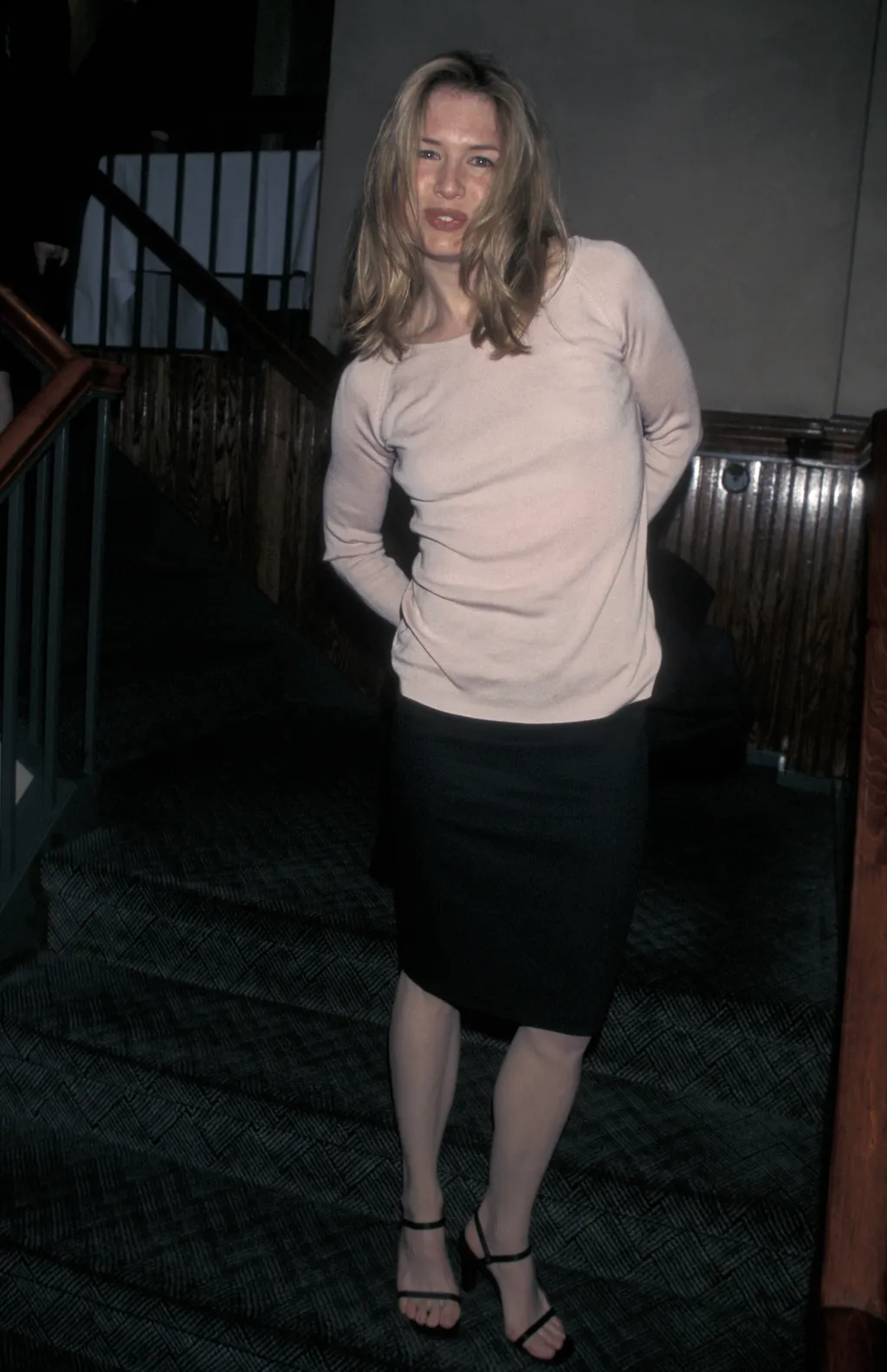 Image may contain Rene Zellweger Clothing Skirt Blouse Architecture Building House Housing Staircase and Adult
