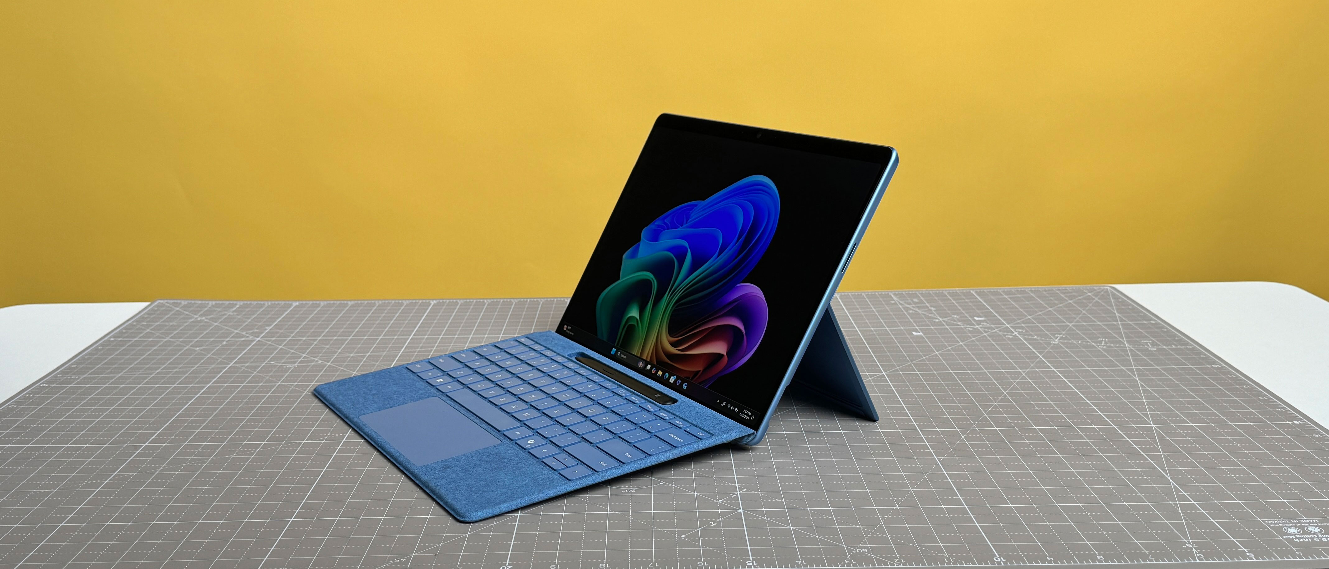 A Microsoft Surface Pro (11th Edition) with a blue keyboard. The slim design fits easily in a backpack and works great with a stylus.