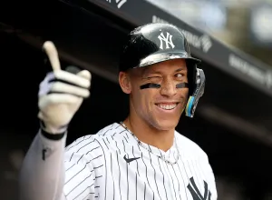 NEW YORK, NEW YORK - APRIL 16: Aaron Judge #99 of the New York Yankees celebrates in the dugout after hitting a solo home run in the first inning against the Los Angeles Angels at Yankee Stadium on April 16, 2026 in The Bronx borough of New York City. (Photo by Elsa/Getty Images)