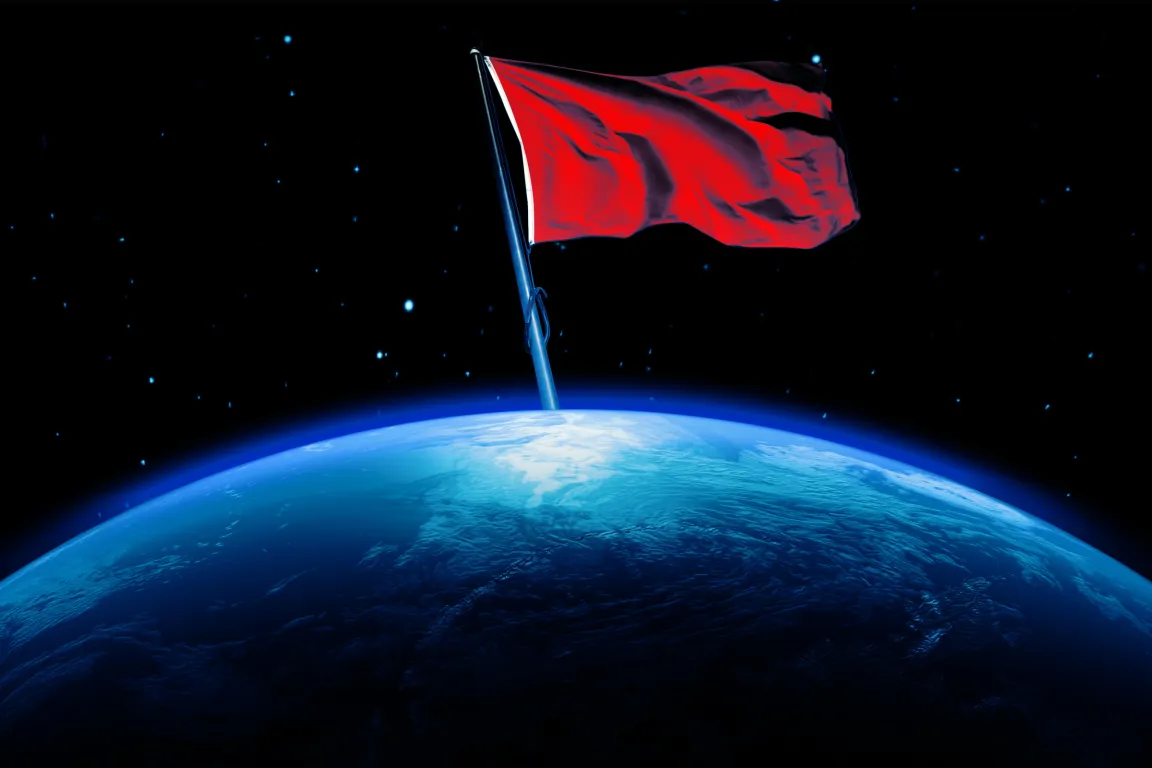 A red flag with a white edge is planted on a blue and white Earth, set against a dark space background filled with scattered stars. The flag appears to be waving, and the Earth is shown with visible cloud patterns and ocean textures.