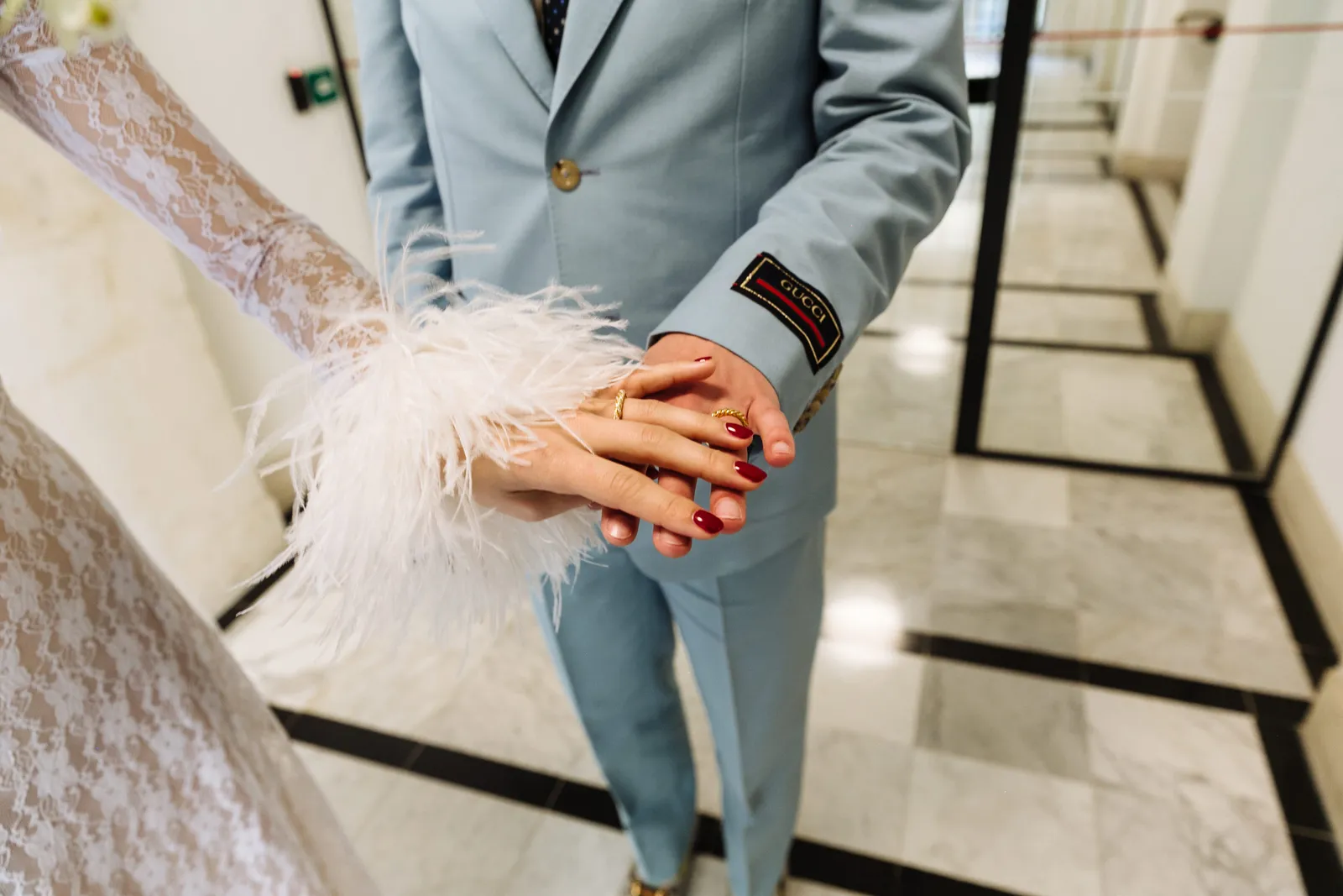 Image may contain Blazer Clothing Coat Jacket Body Part Finger Hand Person Cuff Adult Formal Wear and Suit