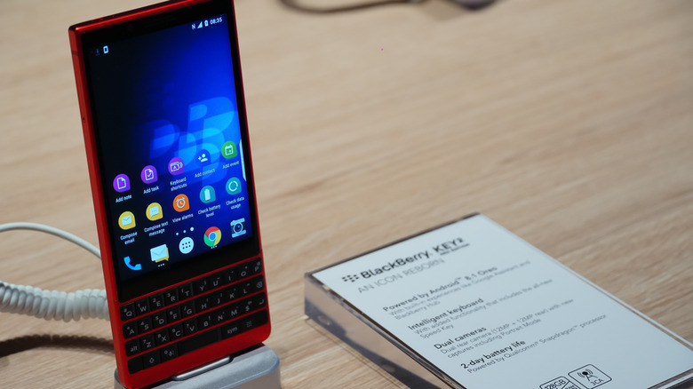 BlackBerry KEY2 on display stand showing screen and keyboard