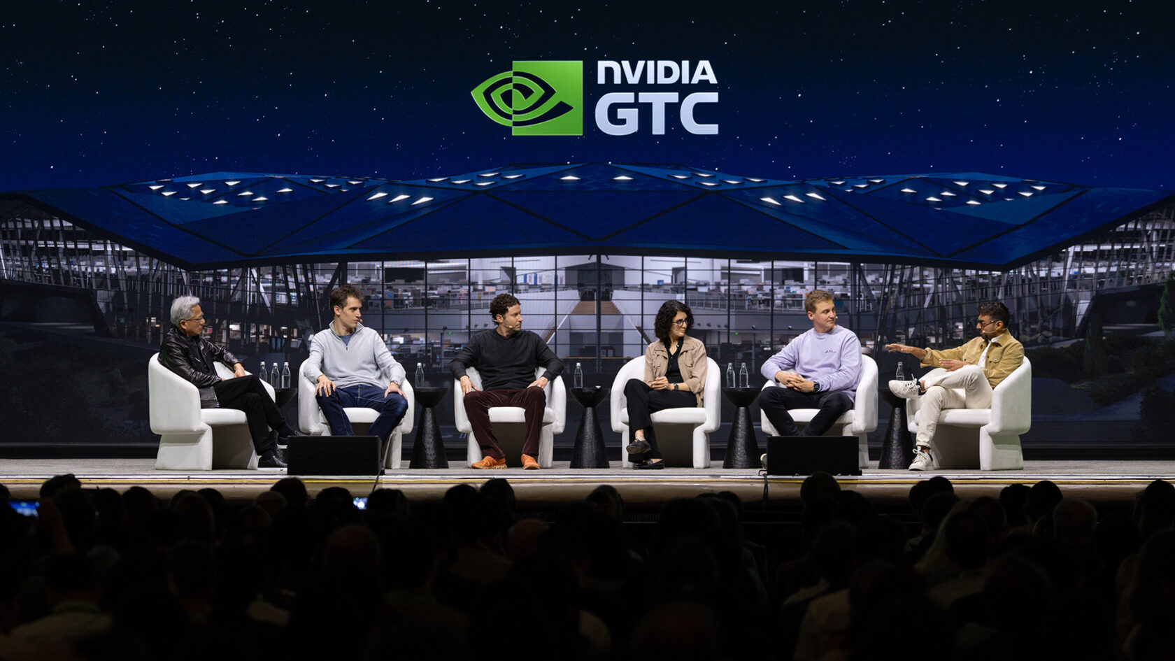 Panelists seated from left to right: NVIDIA founder and CEO Jensen Huang; Mistral cofounder and CEO Arthur Mensch; OpenEvidence CEO Daniel Nadler; Hanna Hajishirzi, senior director of natural language processing at Ai2; Black Forest Labs cofounder and CEO Robin Rombach; and Anjney Midha, founder of AMP PBC.