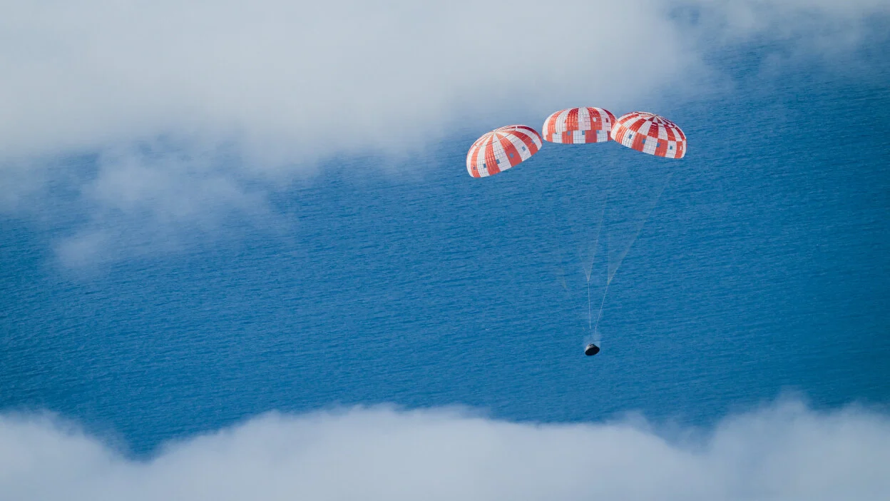 Orion spacecraft splashing down into the Pacific Ocean