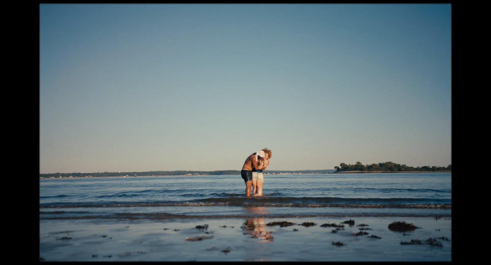 Image may contain Beach Coast Nature Outdoors Sea Shoreline Water Clothing Shorts Face Head and Person