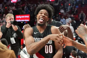 PORTLAND, OREGON - MARCH 08: Scoot Henderson #00 of the Portland Trail Blazers celebrates with teammates following a win against the Indiana Pacers at Moda Center on March 08, 2026 in Portland, Oregon. NOTE TO USER: User expressly acknowledges and agrees that, by downloading and or using this photograph, User is consenting to the terms and conditions of the Getty Images License Agreement. (Photo by Soobum Im/Getty Images)
