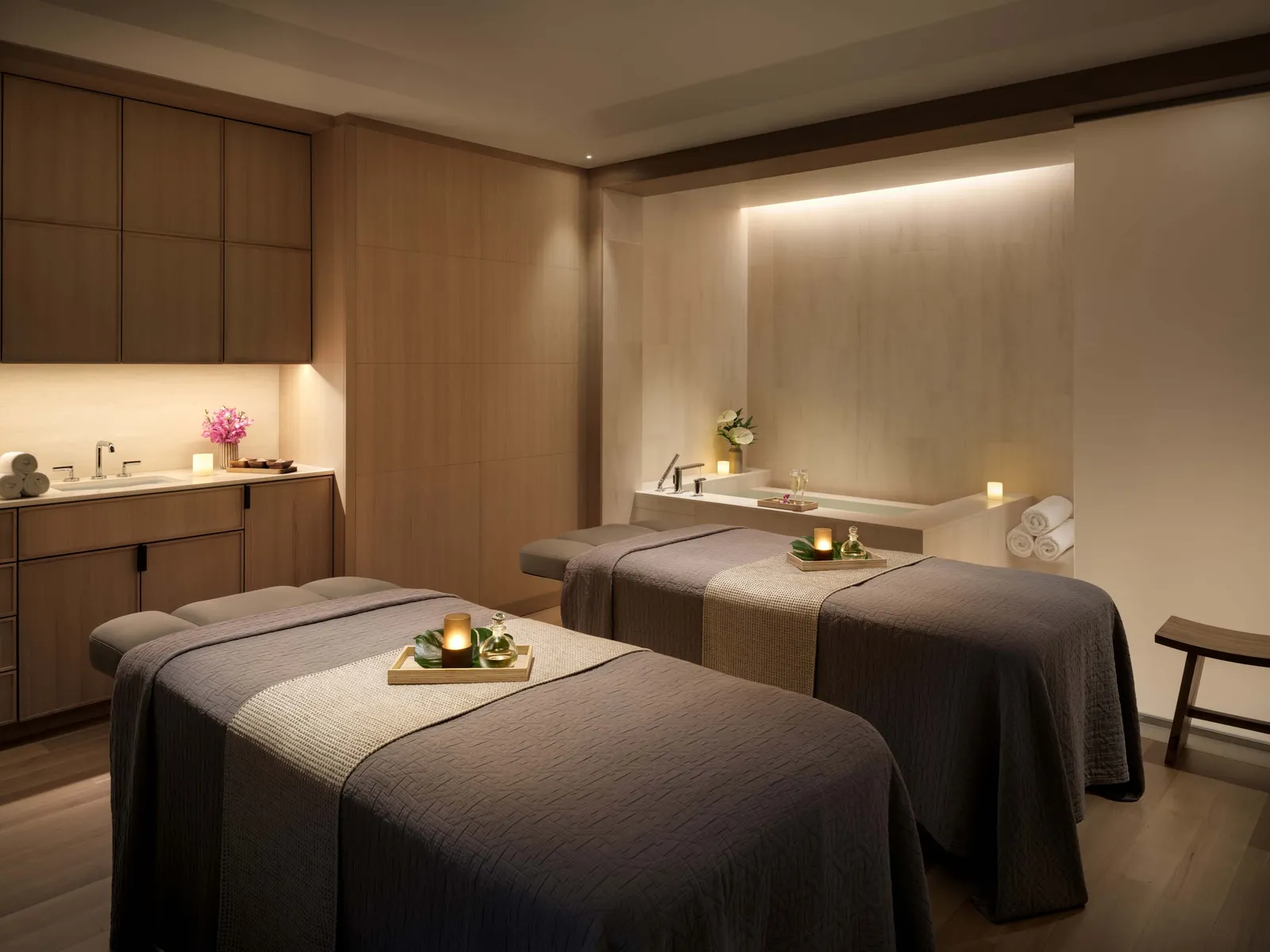 Image may contain Bed Furniture Spa Indoors Interior Design Candle Sink and Sink Faucet