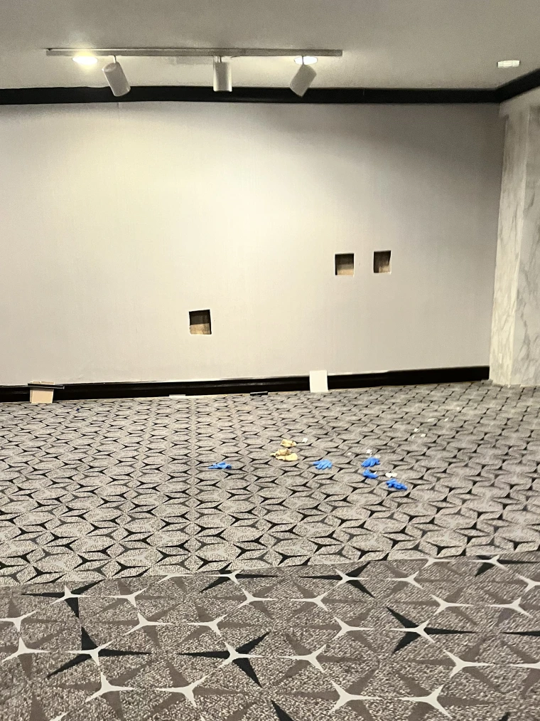 Three square holes in an interior wall of a hotel.