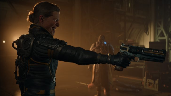 A character in 'Starfield' aiming a futuristic weapon in a dimly lit industrial setting.