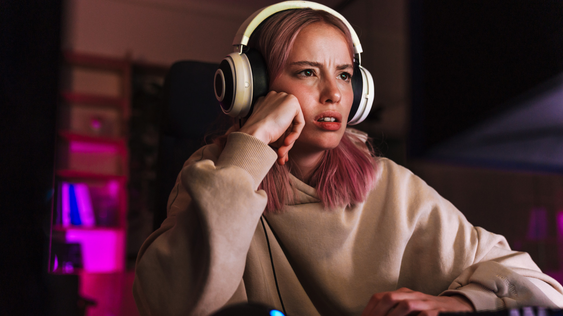 A frustrated looking girl fed up with the price of RAM for her gaming PC