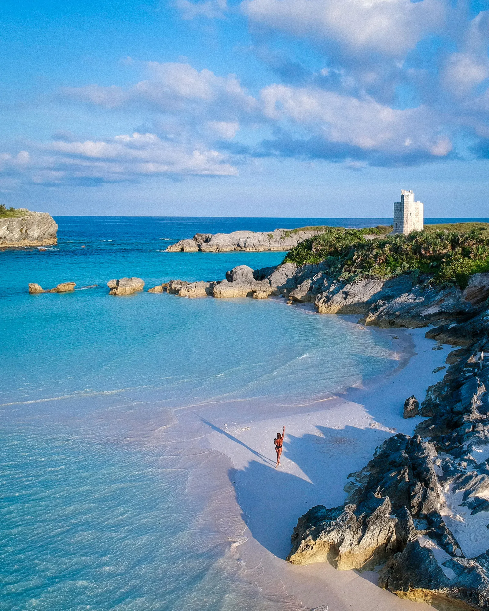 This image may contain Shoreline Water Outdoors Nature Land Promontory Ocean Sea Coast Human Person and Beach