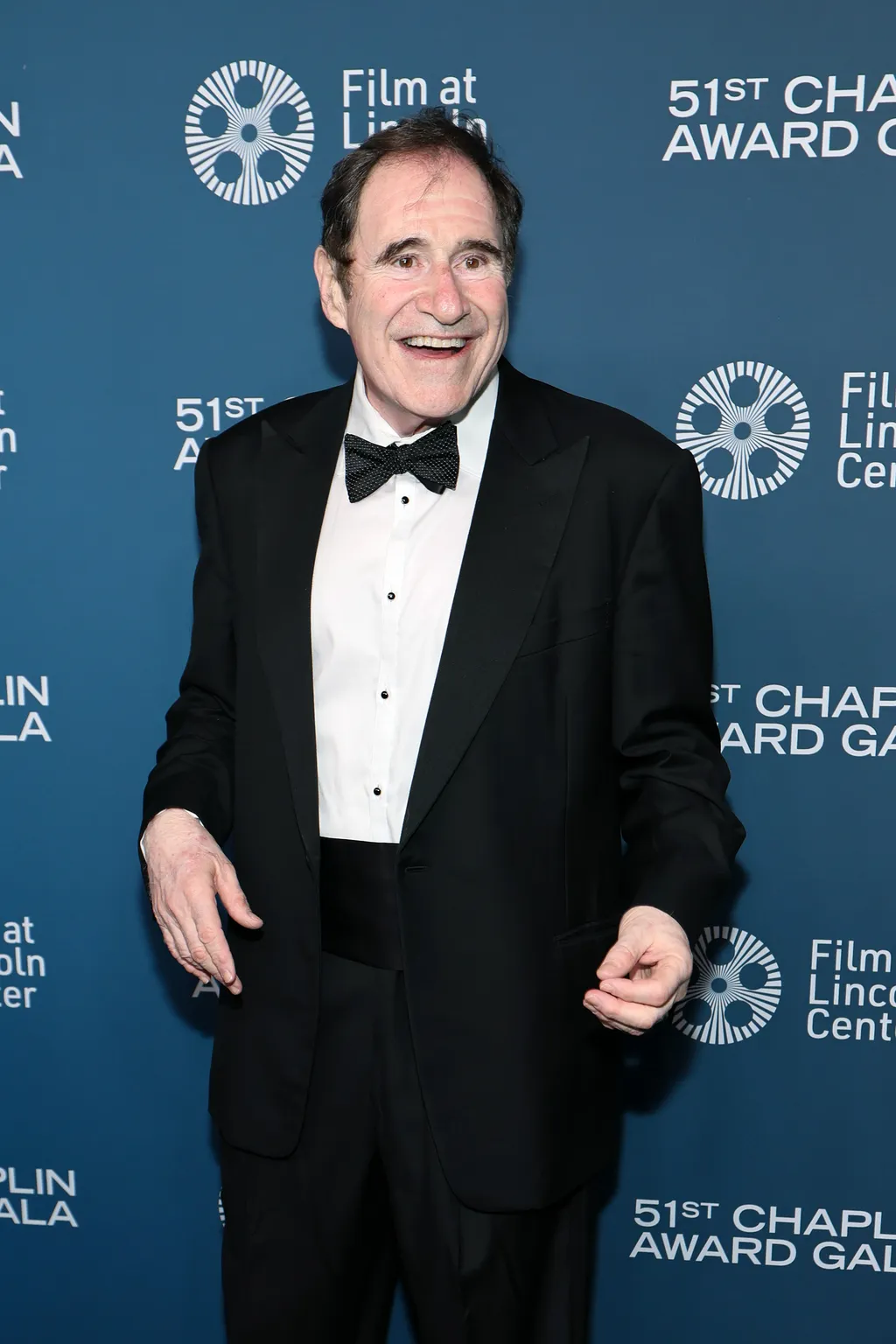 Image may contain Richard Kind Clothing Formal Wear Suit Tuxedo Fashion Adult Person Head Face Happy and Smile