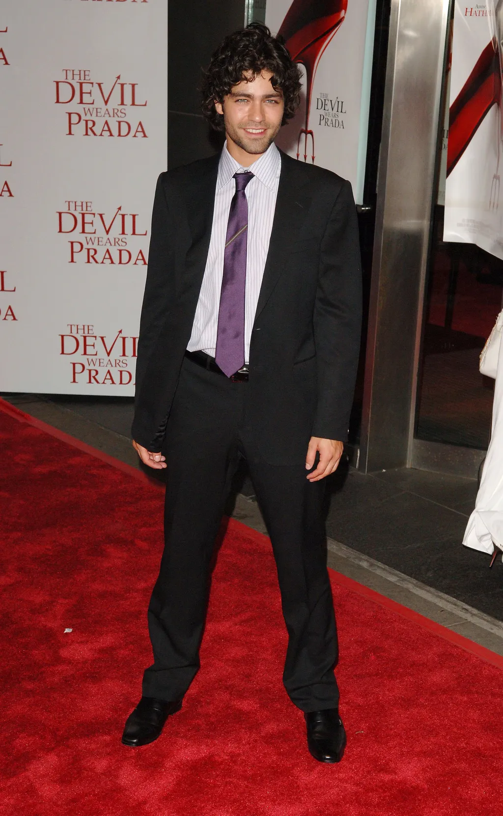 Image may contain Adrian Grenier Fashion Clothing Formal Wear Suit Accessories Tie Adult Person Coat and Standing