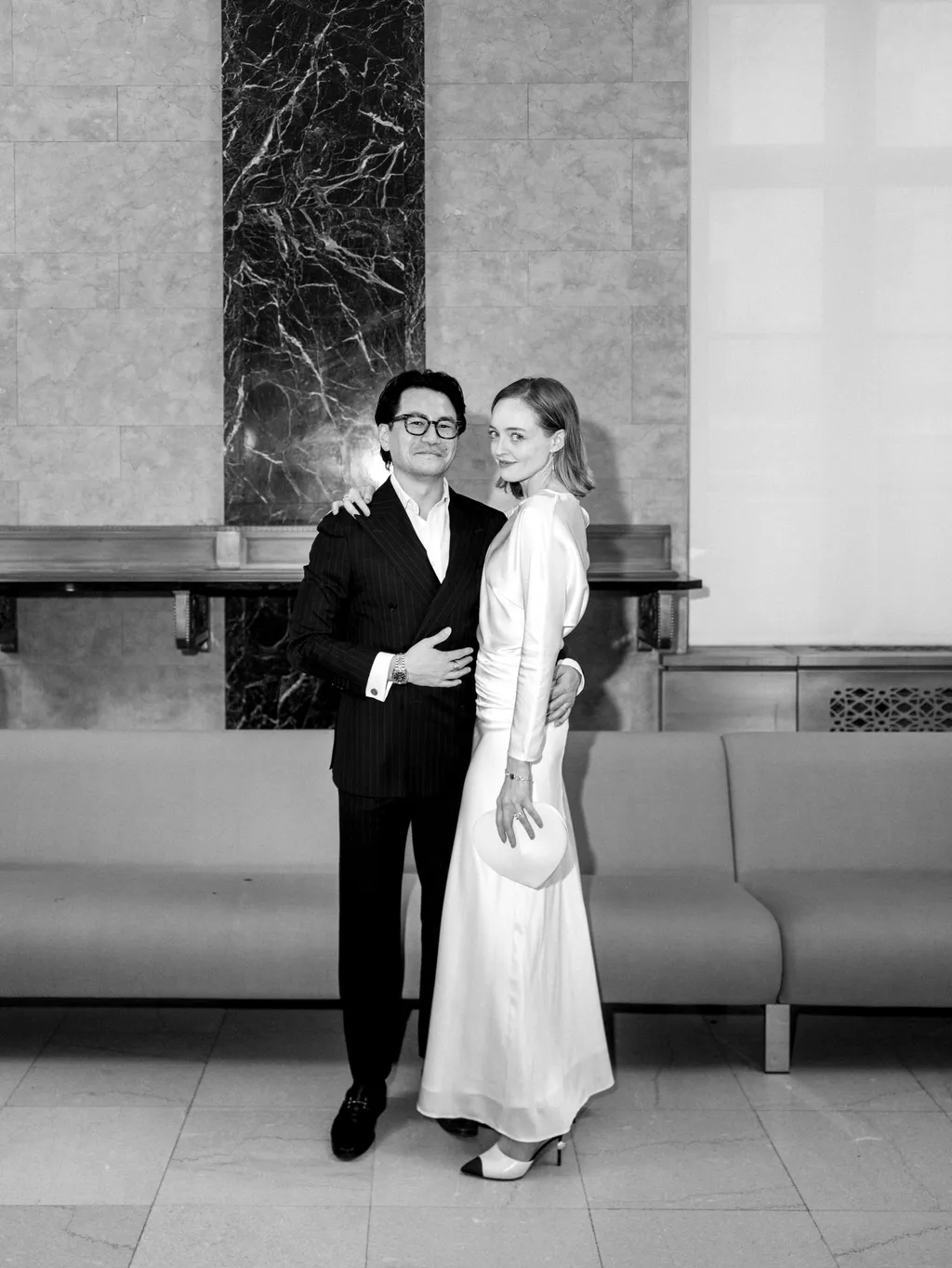 Image may contain Clothing Formal Wear Suit Coat Blazer Jacket Dress Adult Person Wedding Face and Head