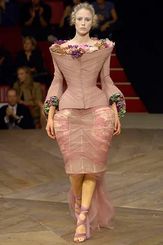 Image may contain Clothing Apparel Human Person Fashion Runway Robe Gown Evening Dress Female Costume and Dress