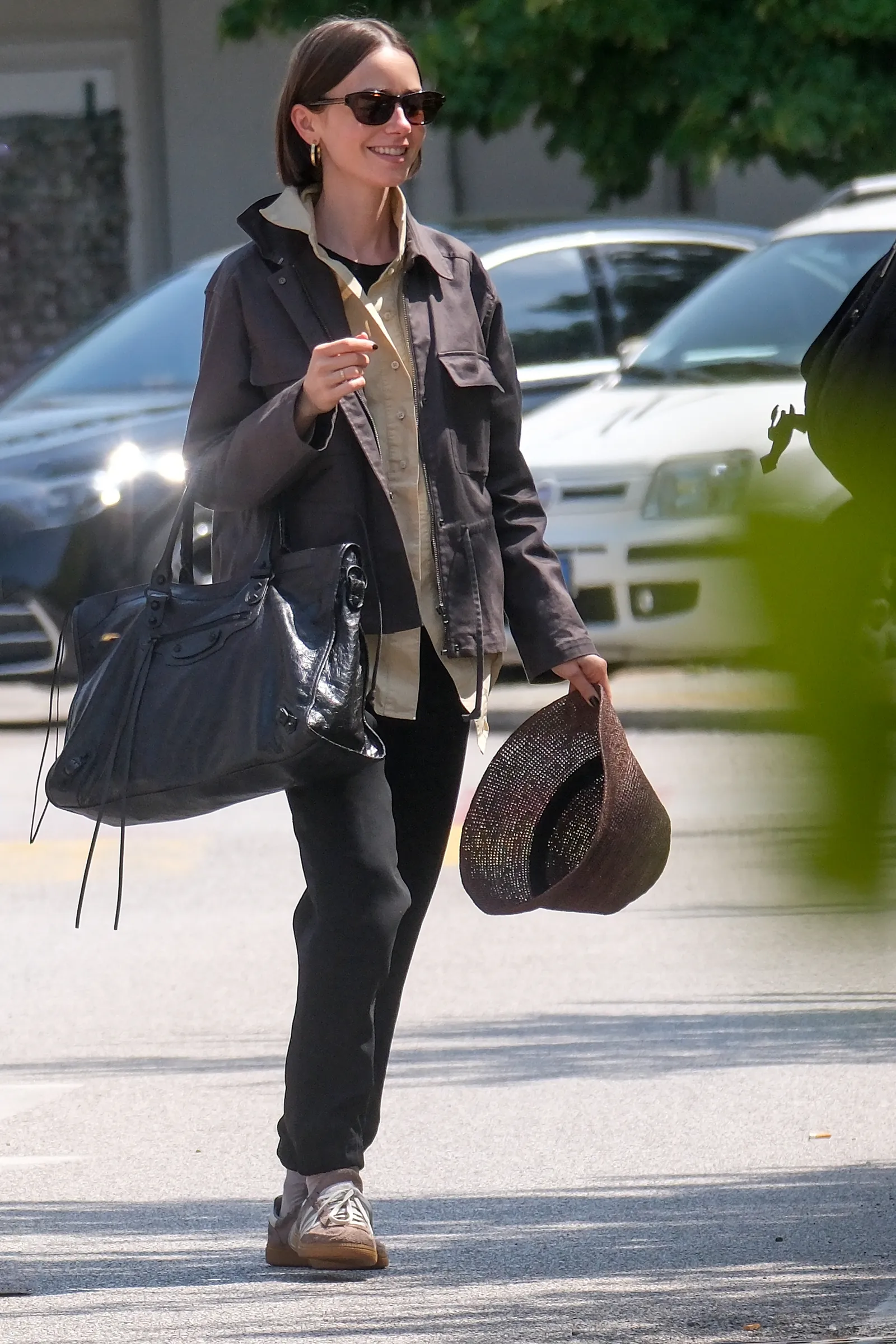 EXCLUSIVE Lily Collins was spotted arriving in Venice ahead of the upcoming filming schedule for Emily in Paris. The...