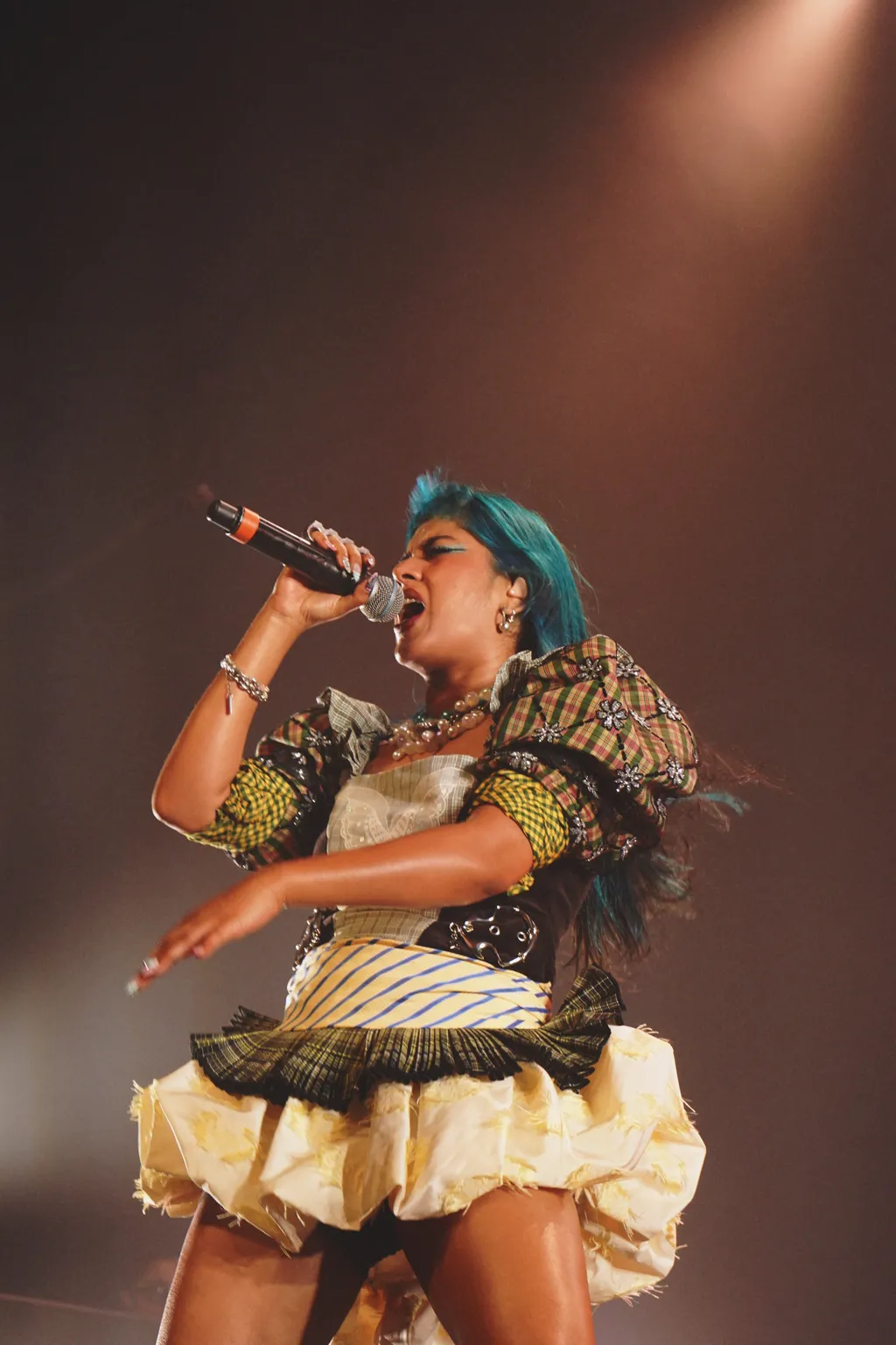 Image may contain Performer Person Solo Performance Adult Electrical Device and Microphone