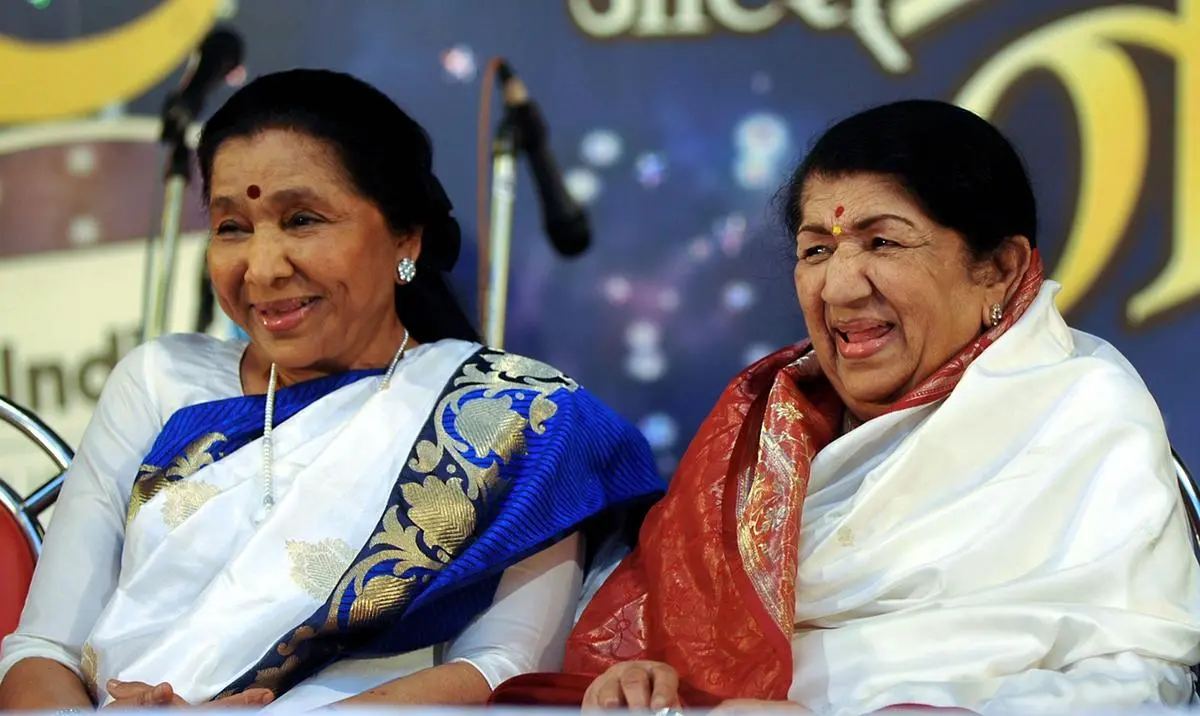 Asha Bhosle and Lata Mangeshkar at Pandit Hridaynath Mangeshkar Award ceremony, in Mumbai, on March 31, 2013.