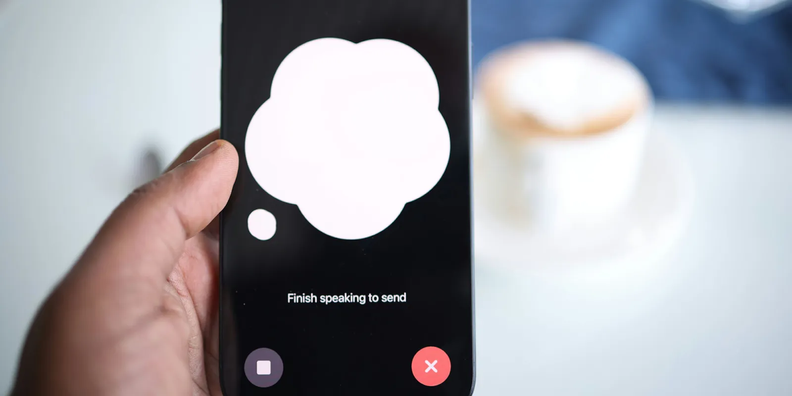 How to opt out of data collection in popular AI apps | Image shows a ChatGPT voice model on an iPhone with a cup of coffee in the background