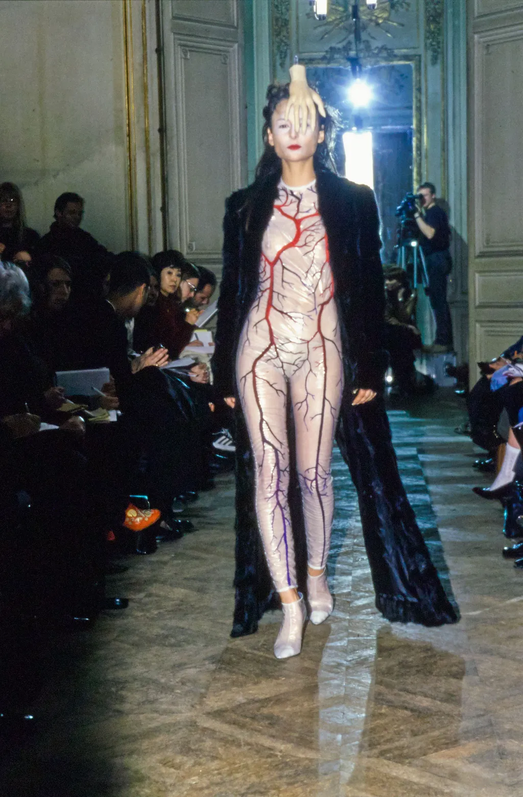 Image may contain Human Person Costume Footwear Clothing Apparel Shoe Runway Fashion and Crowd