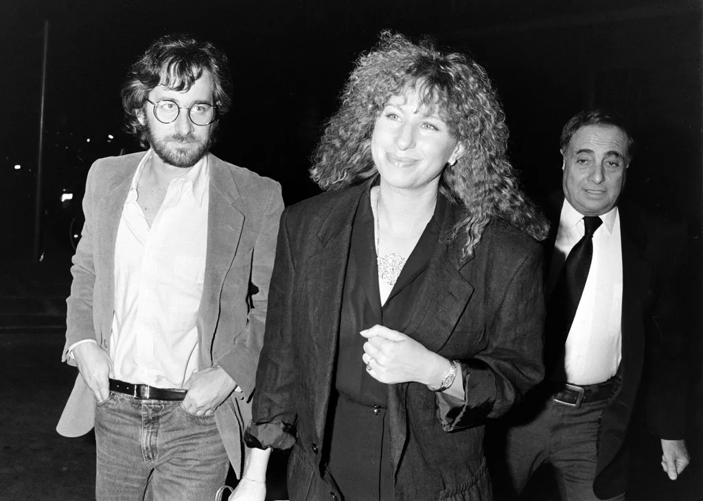 Image may contain Barbra Streisand Steven Spielberg Human Person Clothing Apparel Suit Coat Overcoat and Tie