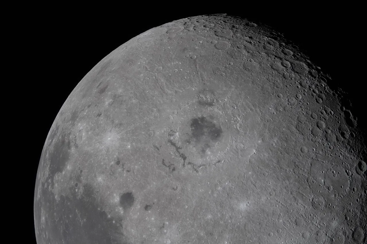 The crew got a perfect look at the Orientale basin, a "black patch of ancient lava in the center that punched through the Moon’s crust in an eruption billions of years ago," per NASA.