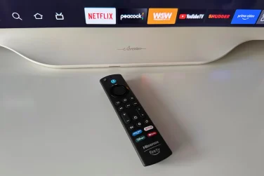 Hisense Déco TV remote laying on dresser near TV