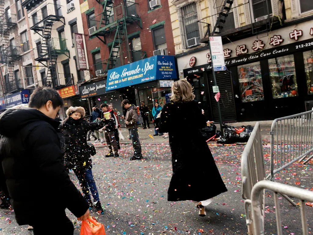 Image may contain Kaliesha West People Person Adult Confetti Paper City Clothing Coat Urban Footwear and Shoe