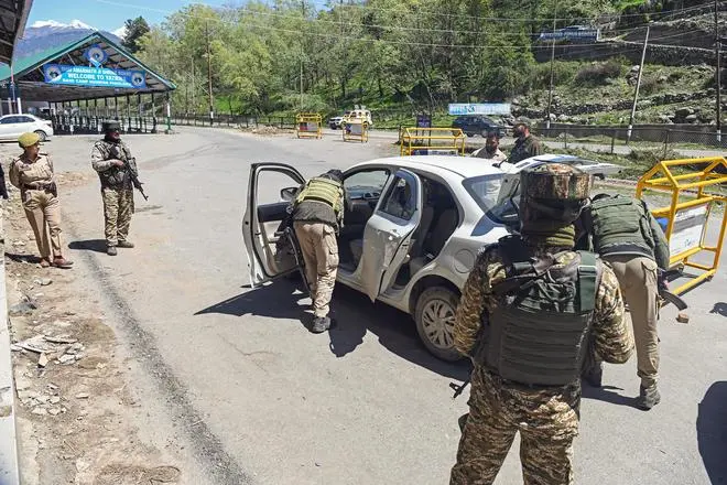 Security personnel check vehicles at Pahalgam town, on the first anniversary of Pahalgam terror attack Security personnel check vehicles at Pahalgam town, on the first anniversary of Pahalgam terror attack