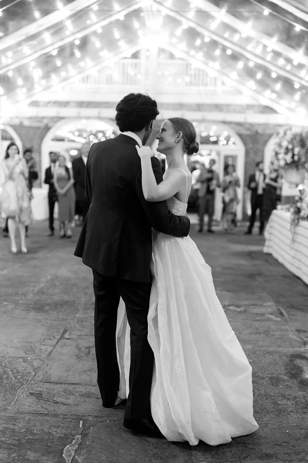 Image may contain Clothing Formal Wear Suit Face Head Person Photography Portrait Dress Fashion Gown and Wedding