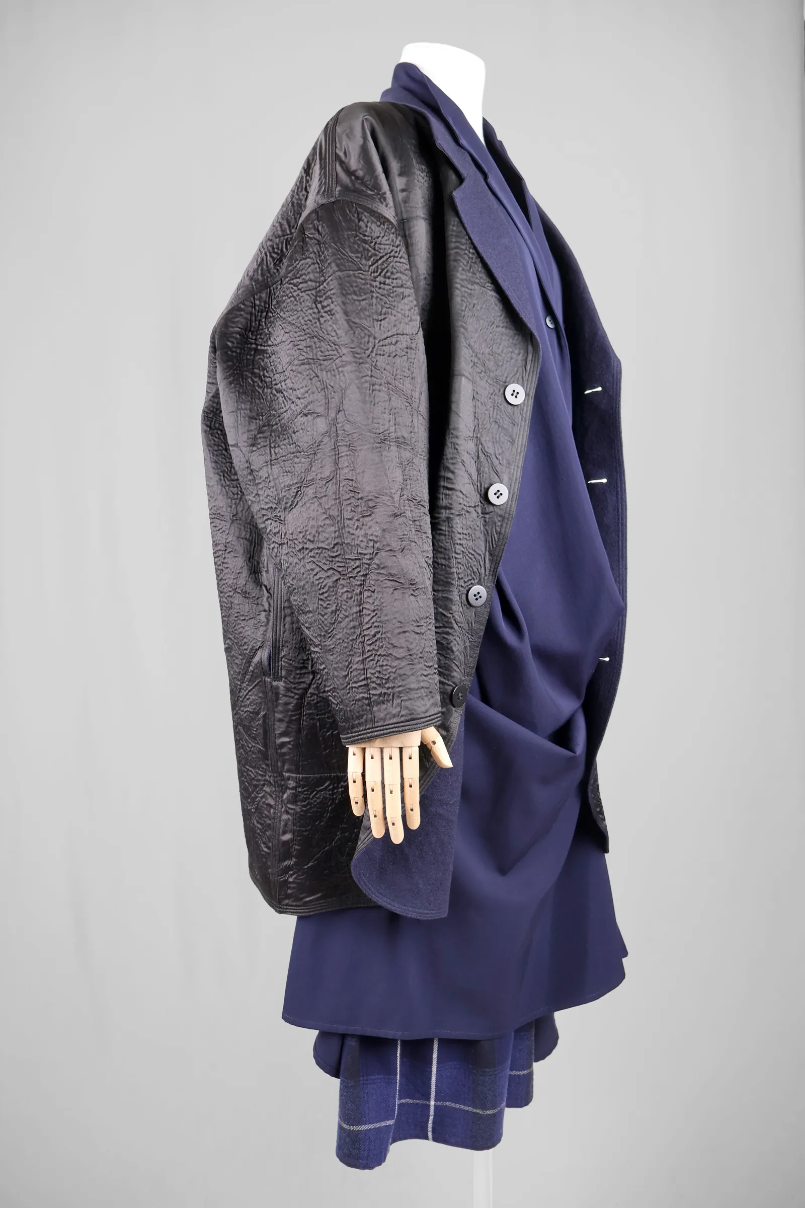 Image may contain Clothing Coat Jacket Blazer Overcoat Long Sleeve Sleeve Formal Wear and Suit