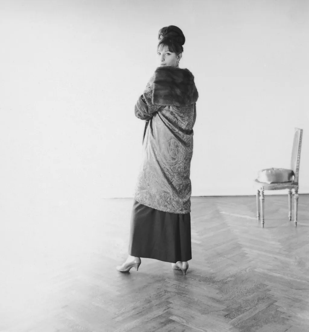 Modeling a vintage coat from her wardrobe. “I haunt local thrift shops and offbeat stores. You can find more interesting...