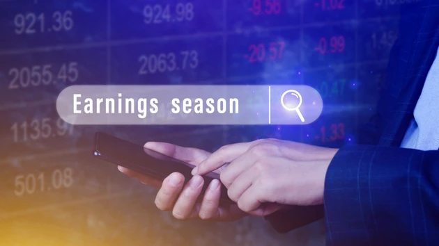 Earnings season, Hand touching of written in search bar with the financial data visible on background with smartphone, Reports Stock Market Ticker Words
