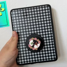 A Kindle in a PopSockets case