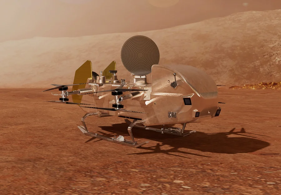 A silvery robotic octocopter, NASA's Dragonfly drone, rests on the austere, otherworldly landscape of Saturn's moon, Titan.