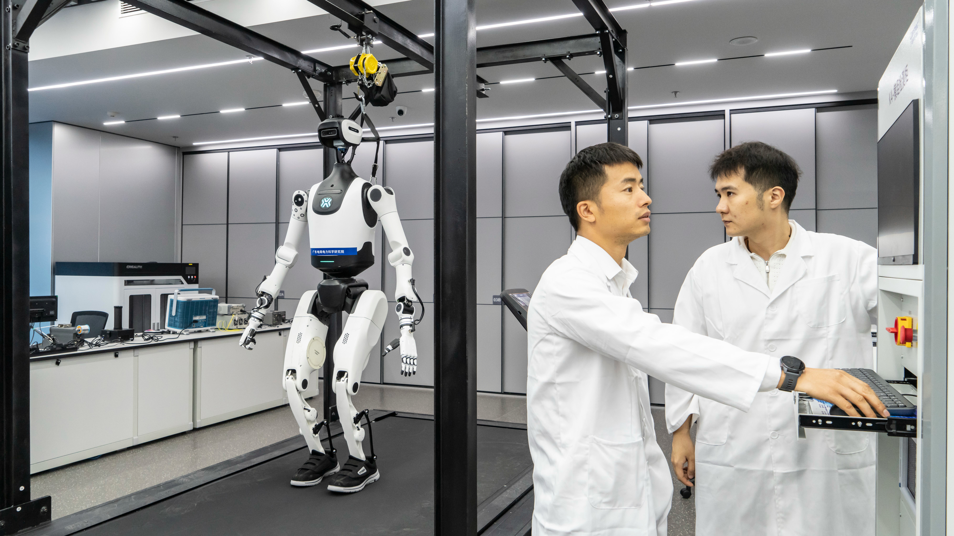 Employees at the China Southern Power Grid operating humanoid robots