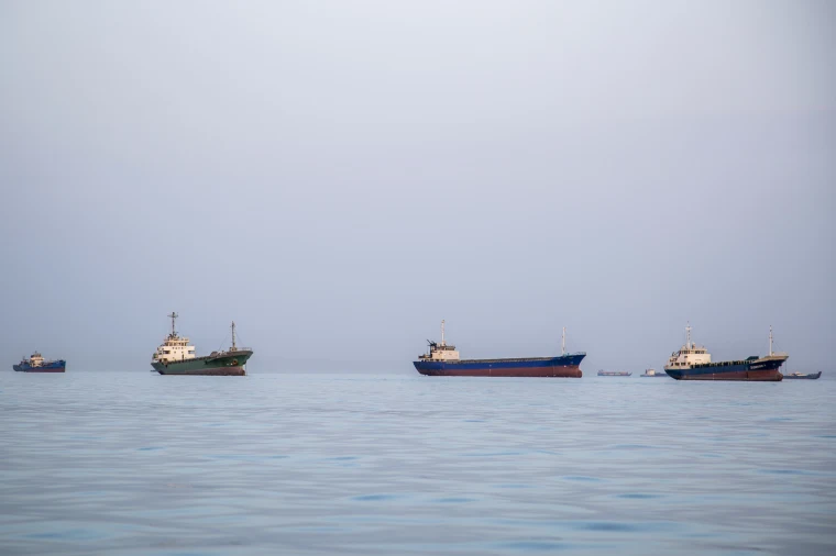 Ships are anchored near the shoreline in Bandar Abbas, Iran.