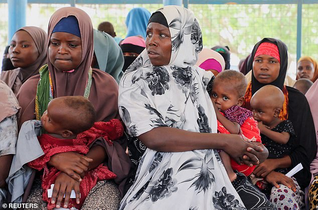 Internally displaced Somali women carry their children as they wait for medication at the Daynile hospital as shortages of lifesaving therapeutic foods caused by shipping disruptions due to the Iran war have forced clinics treating severely malnourished children to turn away patients and ration supplies in drought-hit Somalia, in Daynile district of Mogadishu, Somalia April 20, 2026. REUTERS/Feisal Omar