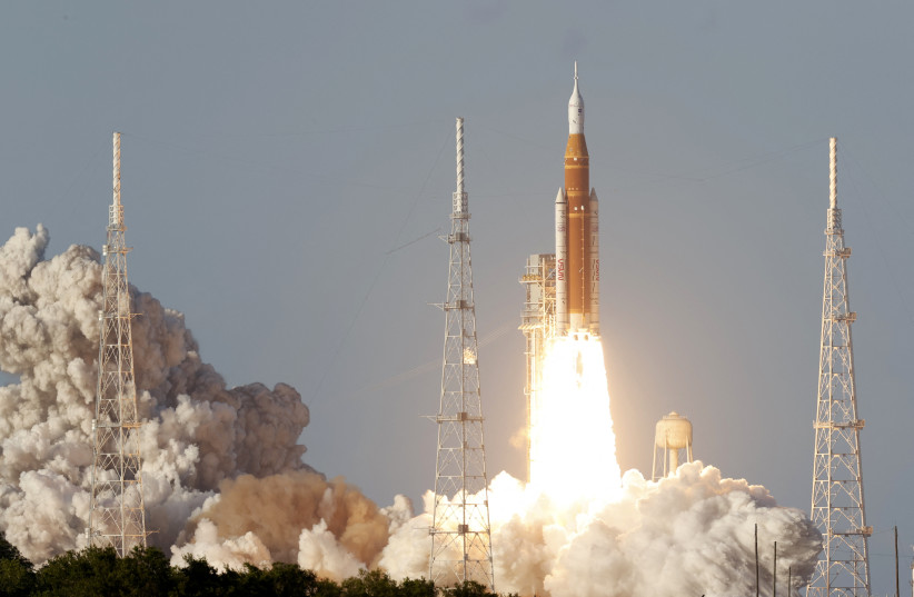NASA's Artemis II mission to fly by the moon, comprising of the Space Launch System (SLS) rocket with the Orion crew capsule, lifts off from the Kennedy Space Center in Cape Canaveral, Florida, US, April 1, 2026