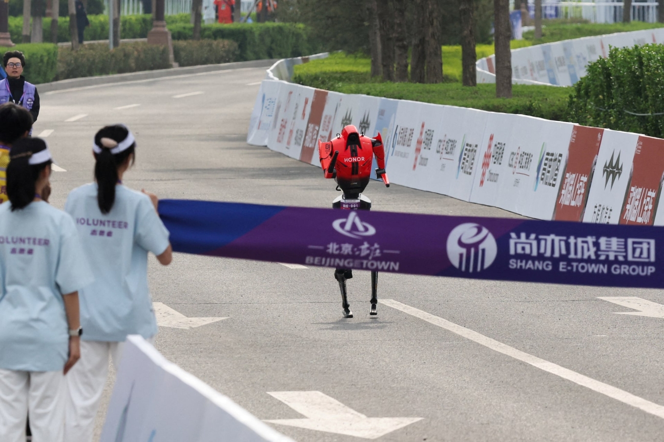 An Honor Lightning humanoid robot runs towards the finish line during the second Beijing E-Town Half Marathon and Humanoid Robot Half Marathon in Beijing, China on April 19, 2026. Photo by Reuters