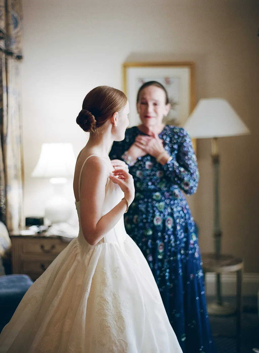 Image may contain Barbara Meier Clothing Dress Person Fashion Formal Wear Gown Wedding Wedding Gown Adult and Lamp