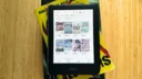 A Kobo Clara Colour on a stack of books