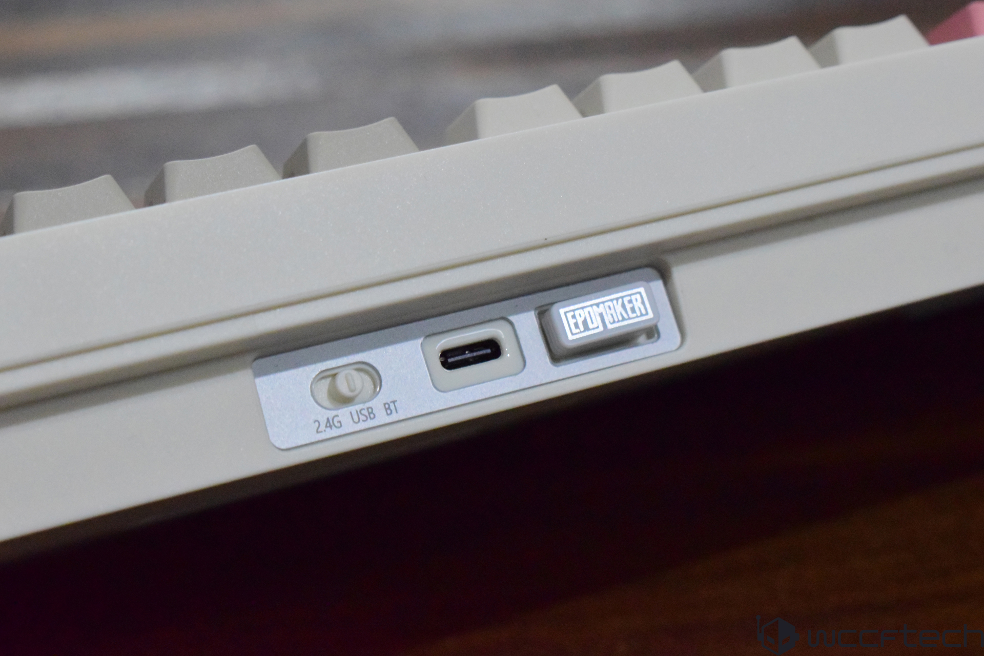 A close-up view shows an EPOMAKER keyboard with a switch labeled '2.4G USB BT' and a USB-C port.