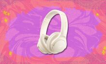 soundcore by anker q20i headphones against a pink and purple patterned background