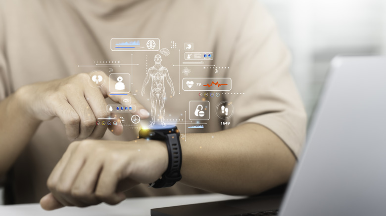Person using a smartwatch to track health and fitnes metrics