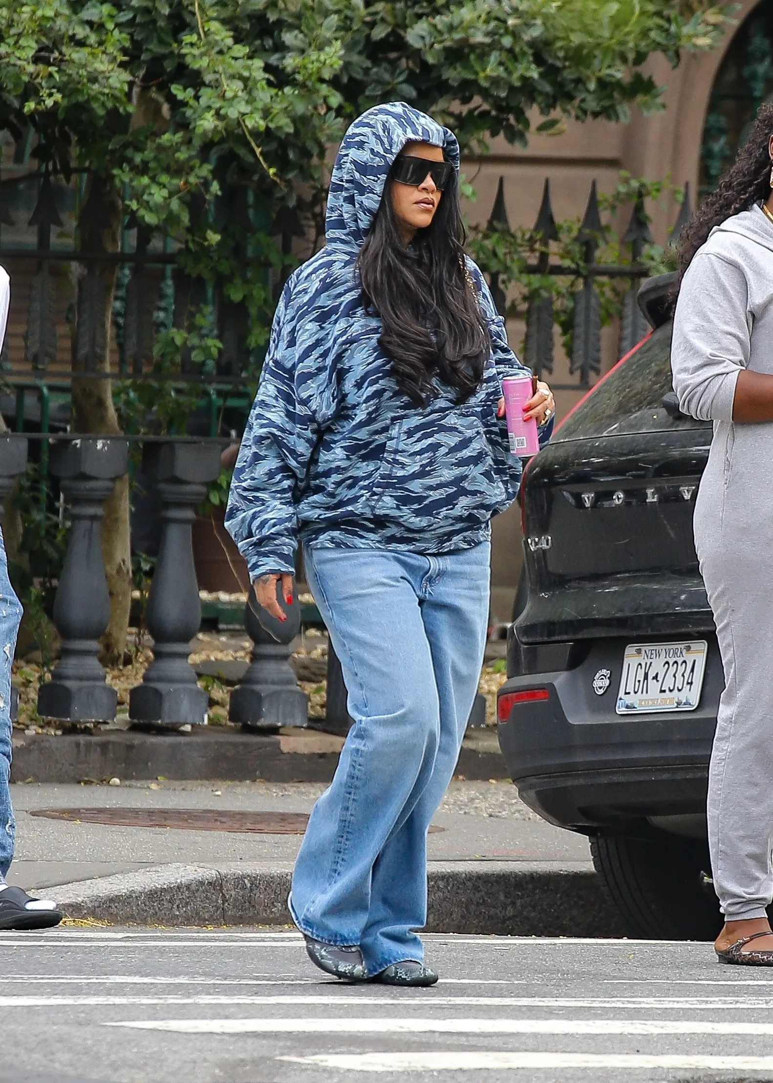 Rihanna keeps it cool in a camo hoodie during a laidback stroll in Brooklyn New York