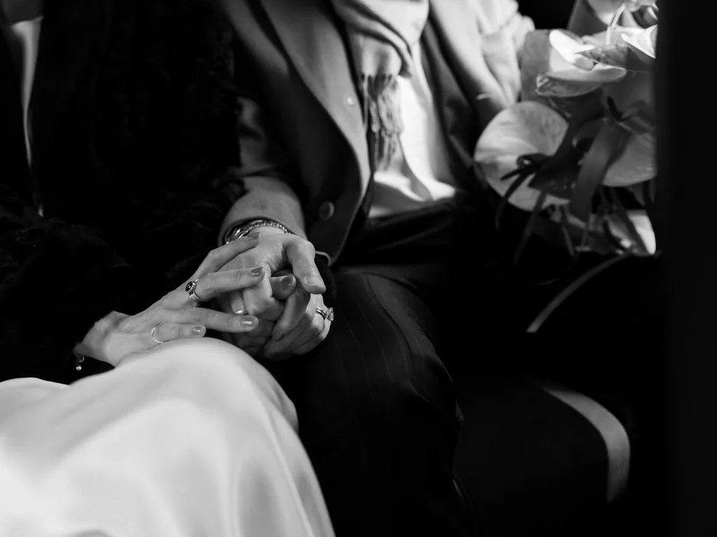 Image may contain Body Part Finger Hand Person Adult Clothing Formal Wear and Suit